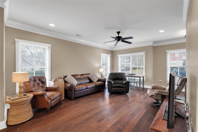 living room with crown molding, visible vents, dark wood-type flooring, and recessed lighting