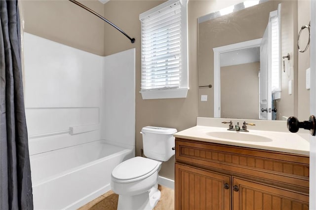 bathroom with toilet, shower / bath combo, and vanity