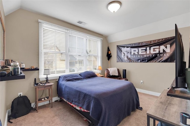 carpeted bedroom featuring vaulted ceiling, visible vents, and baseboards