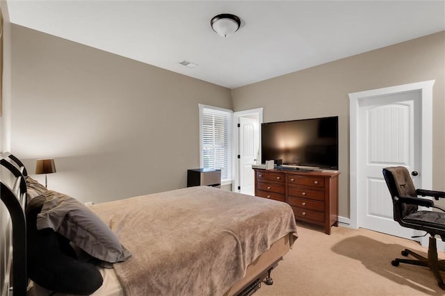 bedroom with light colored carpet and visible vents