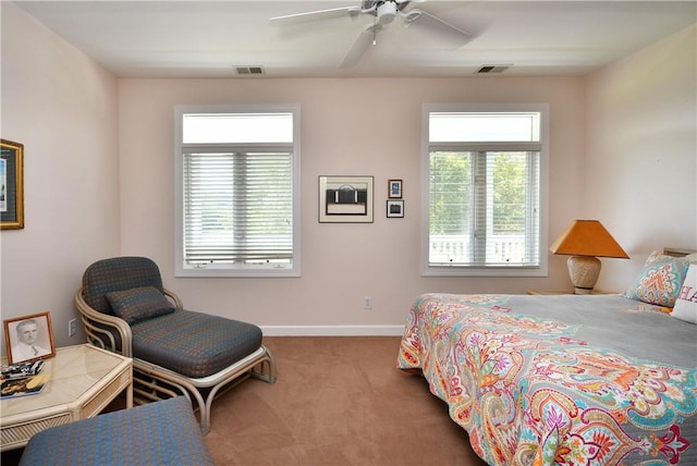 bedroom featuring carpet floors, a ceiling fan, visible vents, and baseboards