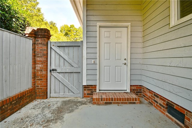 entrance to property with a gate and fence