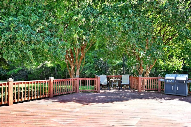 wooden deck with area for grilling