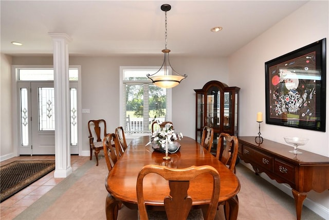 dining space featuring light tile patterned floors, baseboards, decorative columns, and recessed lighting