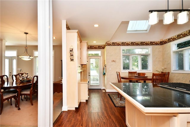 kitchen with dark wood-style floors, recessed lighting, decorative light fixtures, and decorative columns