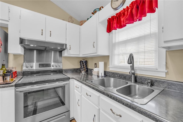 kitchen featuring lofted ceiling, white cabinetry, a sink, under cabinet range hood, and stainless steel electric range