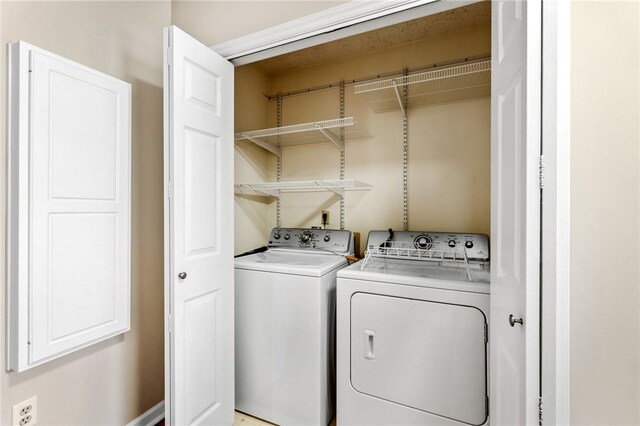 washroom featuring laundry area and washer and clothes dryer