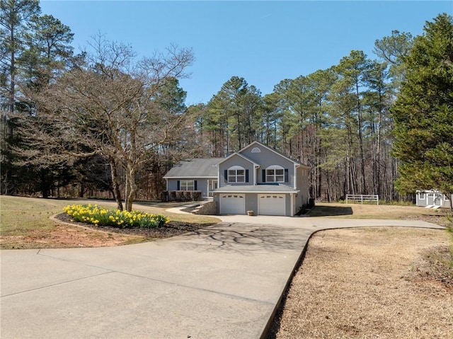 view of front facade featuring a garage and concrete driveway