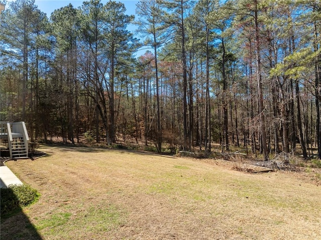 view of yard featuring a view of trees