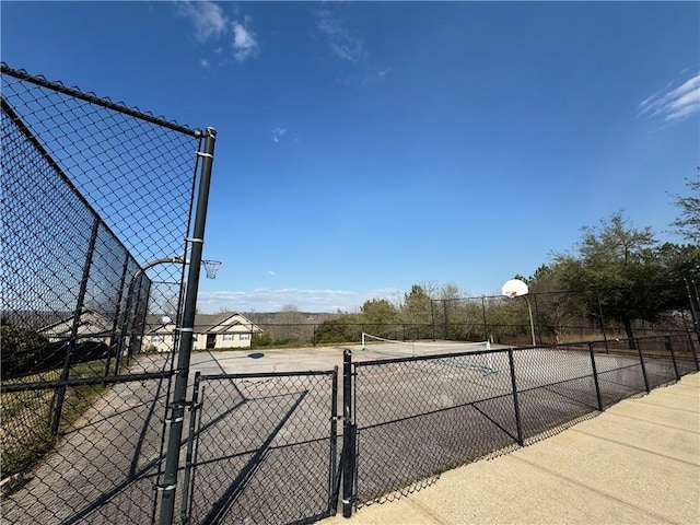 view of sport court featuring community basketball court and fence