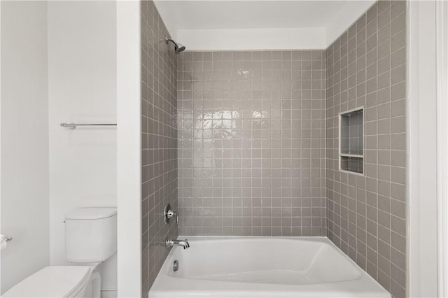 full bathroom featuring tub / shower combination and toilet