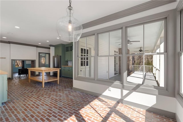 dining room featuring brick floor, recessed lighting, ornamental molding, and baseboards