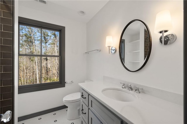 bathroom with vanity, tile patterned floors, toilet, and visible vents