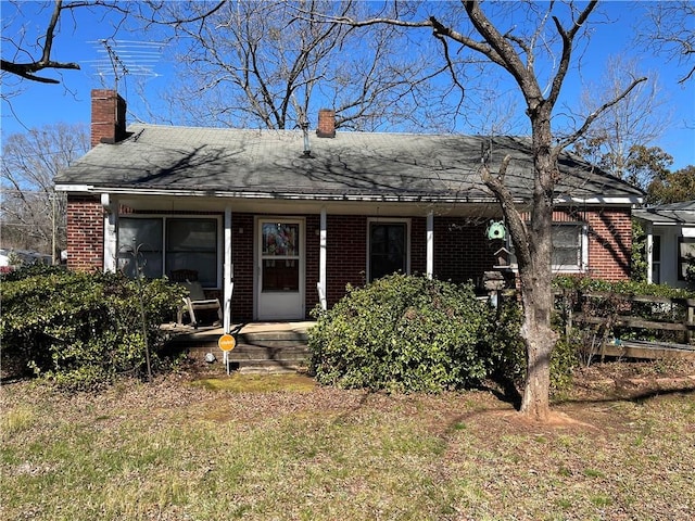 303 Corning St, Anderson, SC 29624 - view of front of home with a chimney and brick siding