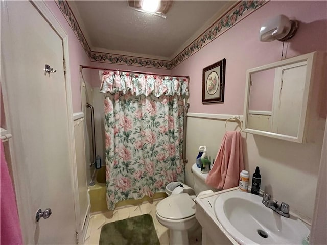 303 Corning St, Anderson, SC 29624 - bathroom with toilet, tile patterned flooring, a sink, and shower / tub combo with curtain