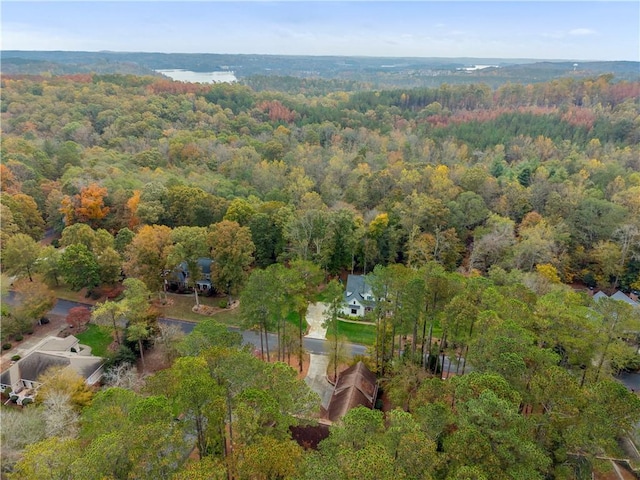 drone / aerial view featuring a view of trees