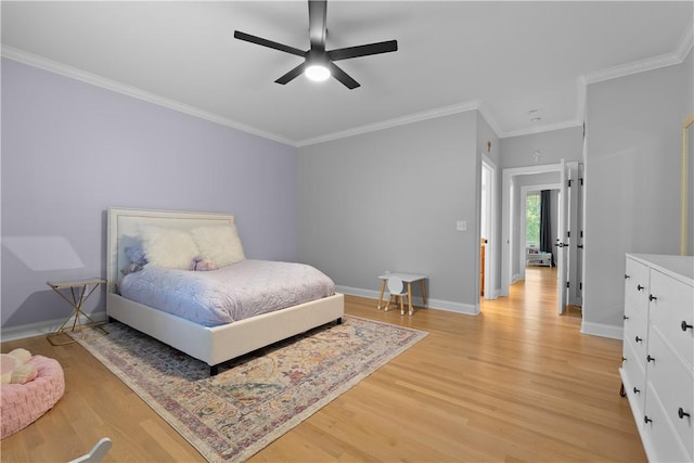 bedroom with baseboards, crown molding, light wood finished floors, and ceiling fan