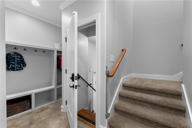 mudroom with baseboards and ornamental molding