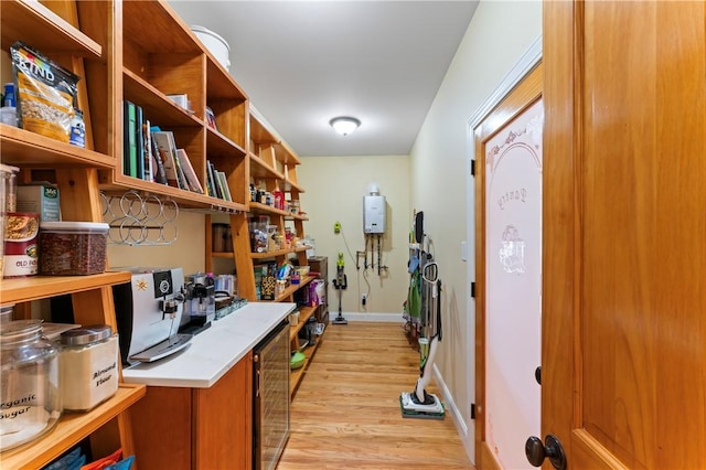 interior space with light wood-style flooring, baseboards, light countertops, brown cabinets, and open shelves