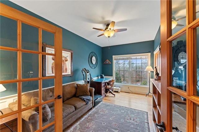 home office featuring a ceiling fan and wood finished floors