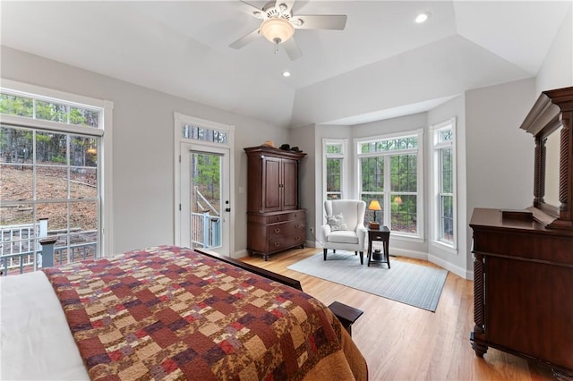 bedroom featuring baseboards, access to outside, vaulted ceiling, light wood-type flooring, and recessed lighting