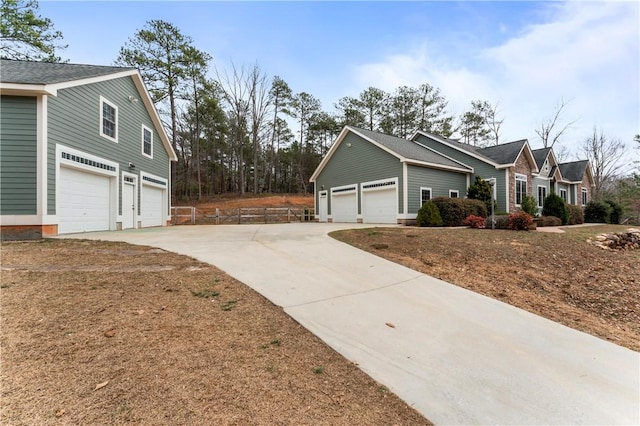 view of side of home with concrete driveway