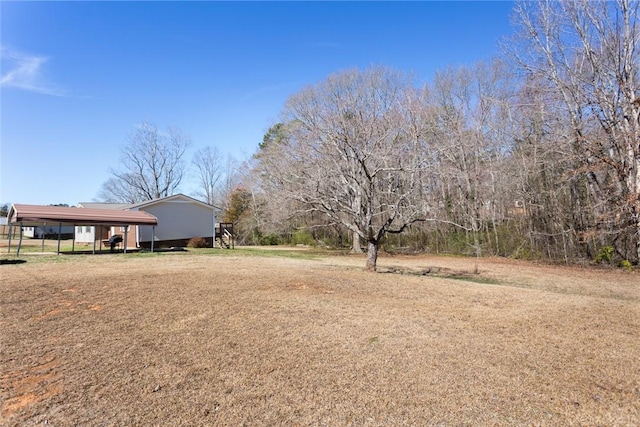 view of yard featuring a detached carport