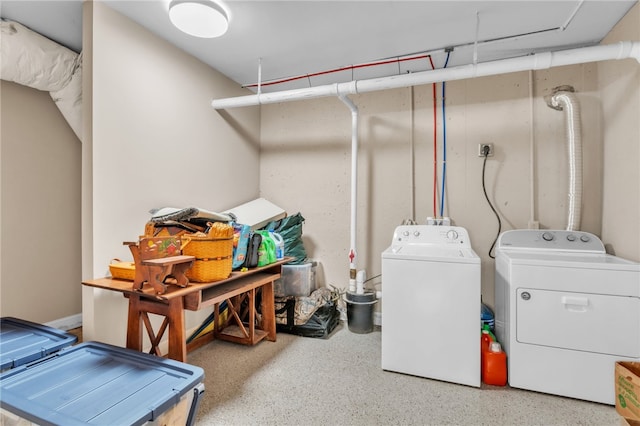 washroom featuring laundry area and washer and clothes dryer