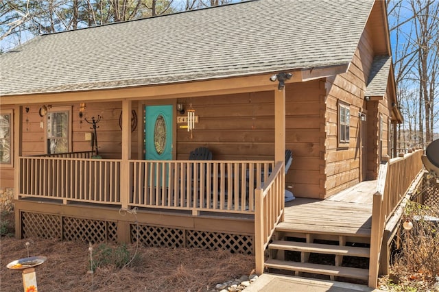 view of front facade featuring a porch and roof with shingles