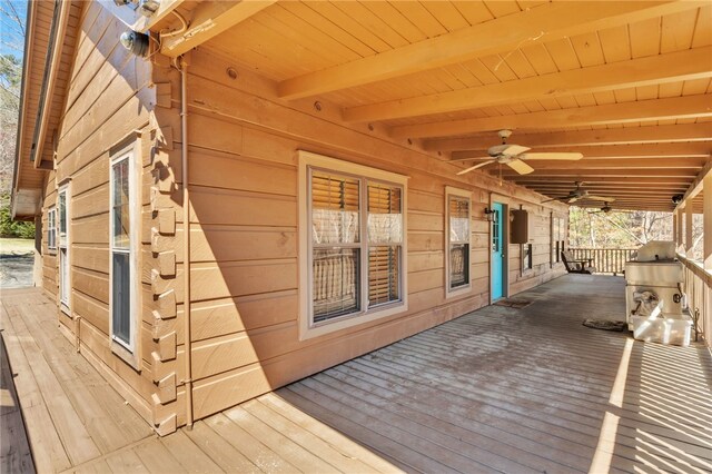 deck featuring ceiling fan and a porch