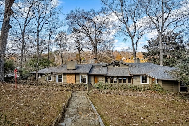 view of front of property featuring a chimney