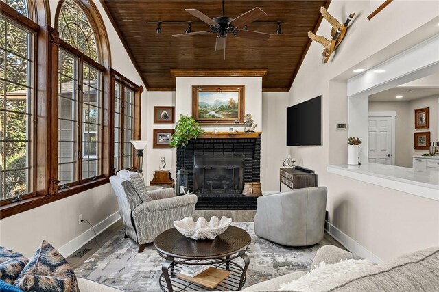 living room with wooden ceiling, a fireplace, and baseboards