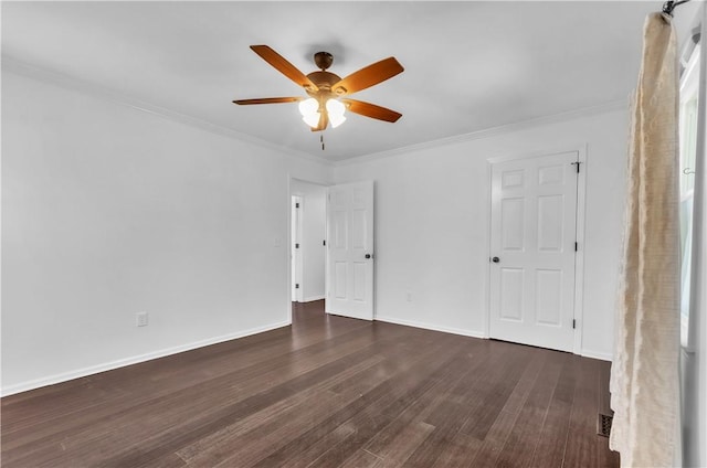 unfurnished bedroom featuring a ceiling fan, crown molding, baseboards, and wood finished floors