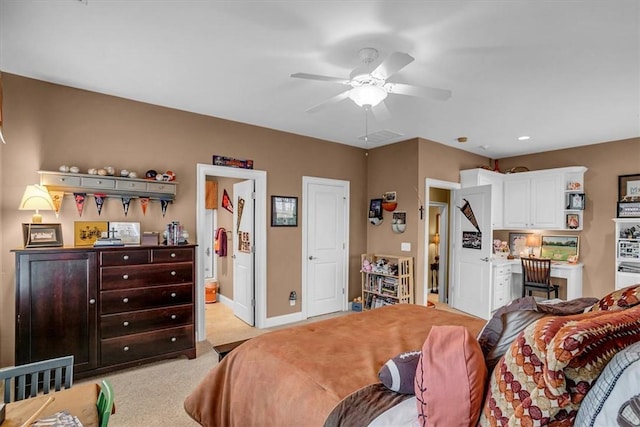 bedroom featuring baseboards, visible vents, and light colored carpet