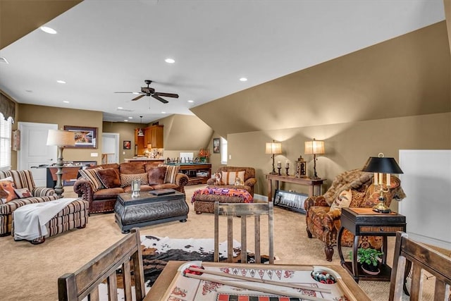 carpeted living area featuring ceiling fan, vaulted ceiling, and recessed lighting