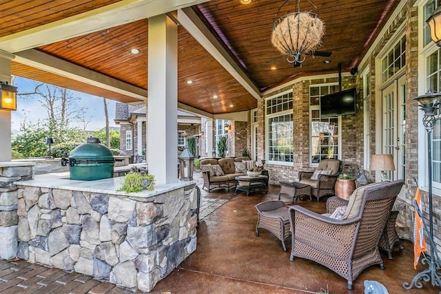 view of patio / terrace with grilling area, outdoor lounge area, and exterior kitchen