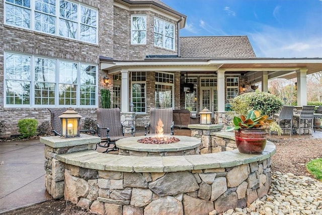 view of patio with a fire pit