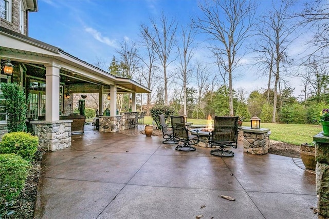 view of patio featuring an outdoor fire pit