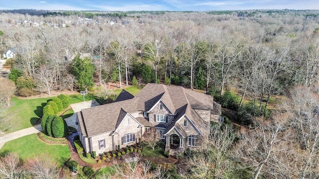 birds eye view of property with a wooded view