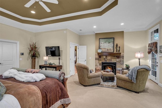 bedroom featuring light carpet, a fireplace, ornamental molding, and recessed lighting