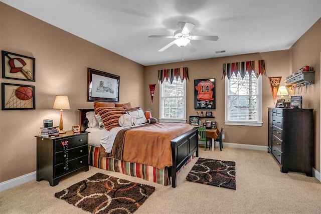 bedroom featuring visible vents, ceiling fan, light colored carpet, and baseboards