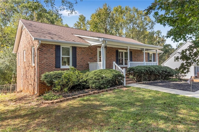400 Quail Run Cir, Fountain Inn, SC 29644 - ranch-style house featuring brick siding, covered porch, a front lawn, and a shingled roof
