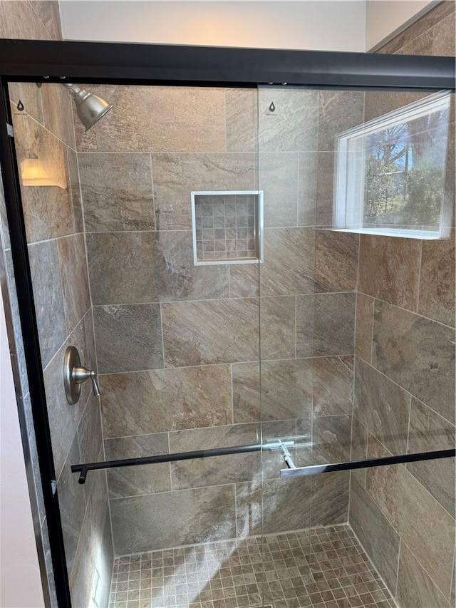 bathroom with a stall shower