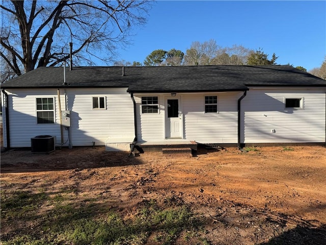 rear view of property featuring cooling unit