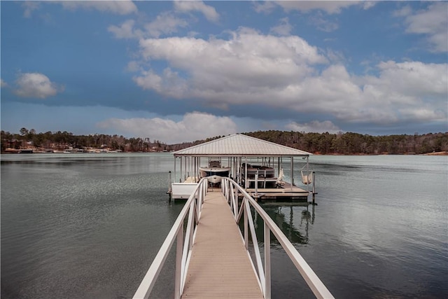 view of dock featuring a water view and boat lift