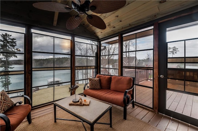 sunroom with lofted ceiling, ceiling fan, a water view, and wood ceiling