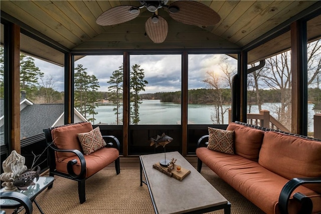 sunroom featuring lofted ceiling, a water view, wood ceiling, and a ceiling fan