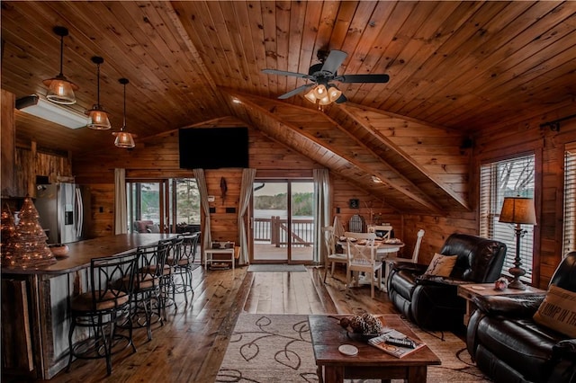 living room featuring wooden ceiling, wood walls, wood-type flooring, and vaulted ceiling