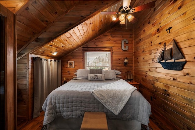 bedroom featuring lofted ceiling, wooden ceiling, wooden walls, and wood finished floors