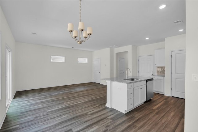 kitchen with an inviting chandelier, a sink, dishwasher, dark wood finished floors, and white cabinetry